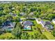 Expansive aerial view of a beautiful home, pool and meticulously landscaped grounds at 2538 Carter Grove Cir, Windermere, FL 34786