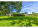 Green and grassy backyard with house in the background at 2538 Carter Grove Cir, Windermere, FL 34786