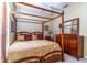 Primary bedroom featuring a four-poster bed and natural light at 2538 Carter Grove Cir, Windermere, FL 34786
