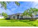Beautiful single-story home with manicured lawn and lush landscaping at 2538 Carter Grove Cir, Windermere, FL 34786