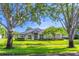 Charming single-story home boasts lush landscaping, mature trees, and inviting curb appeal at 2538 Carter Grove Cir, Windermere, FL 34786