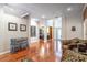 Spacious hallway with hardwood floors offers views of the office and living areas at 2538 Carter Grove Cir, Windermere, FL 34786