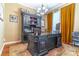 Spacious home office with custom built-ins, stylish decor, and a comfortable workspace at 2538 Carter Grove Cir, Windermere, FL 34786