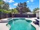 Lovely backyard pool and spa feature a tiled trim; mature landscaping creates a private oasis at 2538 Carter Grove Cir, Windermere, FL 34786