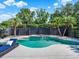 The well-maintained backyard pool area showcases a spa feature and mature landscaping, perfect for relaxation at 2538 Carter Grove Cir, Windermere, FL 34786