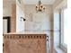 Close-up of the tiled walk-in shower with a decorative chandelier and bench seating at 2538 Carter Grove Cir, Windermere, FL 34786