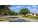 Community basketball court with trees and a well-manicured landscape at 2545 Old Kent Cir, Kissimmee, FL 34758