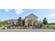 Beautiful community clubhouse with an inviting entrance and manicured landscaping at 2545 Old Kent Cir, Kissimmee, FL 34758