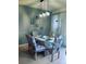 Stylish dining area featuring modern lighting, coffee-themed decor, and seating for six at 2545 Old Kent Cir, Kissimmee, FL 34758
