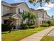 A row of townhomes with well-maintained lawns, sidewalks, and landscaping creates an inviting community feel at 2545 Old Kent Cir, Kissimmee, FL 34758