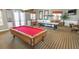 Enjoy the entertainment room with a pool table, air hockey and comfortable seating at 2545 Old Kent Cir, Kissimmee, FL 34758