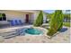 Enjoy the community hot tub with an attractive layout, landscaping, and nearby lounge chairs at 2545 Old Kent Cir, Kissimmee, FL 34758