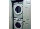 Efficient laundry space showcasing a stacked Samsung washer and dryer at 2545 Old Kent Cir, Kissimmee, FL 34758
