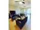 Spacious living room featuring neutral walls, tile flooring, and contemporary furnishings at 2545 Old Kent Cir, Kissimmee, FL 34758