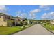 Picturesque street view featuring well-manicured lawns and a variety of attractive homes in a tranquil neighborhood at 2545 Old Kent Cir, Kissimmee, FL 34758