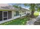 Back exterior view shows windows, door and exterior air conditioning unit of the home at 2724 Shelby Ruth Pl, St Cloud, FL 34769