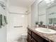 Bright bathroom featuring a shower/tub combo with green towels and stylish vanity at 2724 Shelby Ruth Pl, St Cloud, FL 34769