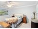 Bright bedroom featuring stylish furnishings, including a faux fur throw, elegant lighting and decorative wall art at 2724 Shelby Ruth Pl, St Cloud, FL 34769