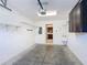 The garage has storage cabinets, sink and access door to the inside of the home at 2724 Shelby Ruth Pl, St Cloud, FL 34769