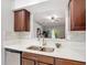 Well-equipped kitchen with updated countertops, stainless steel appliances, and a view into the living room at 2724 Shelby Ruth Pl, St Cloud, FL 34769