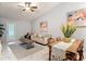 Bright living room with a ceiling fan, neutral paint and decor, and lots of natural light at 2724 Shelby Ruth Pl, St Cloud, FL 34769