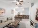 Living room with brick accents and neutral decor open to the dining area at 2724 Shelby Ruth Pl, St Cloud, FL 34769