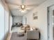 Inviting sunroom featuring comfortable seating, stylish rug, and bright, natural light at 2724 Shelby Ruth Pl, St Cloud, FL 34769