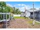 Spacious backyard featuring playset and view of the screened-in patio at 2832 Buccaneer Dr, Winter Park, FL 32792