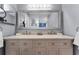 Elegant bathroom featuring a large mirror, double sinks, and ample counter space at 2832 Buccaneer Dr, Winter Park, FL 32792