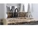 Close up of the bathroom granite countertop with updated black fixtures and decorative accessories at 2832 Buccaneer Dr, Winter Park, FL 32792