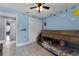 This bedroom offers a bunk bed, ceiling fan, and bright wall decor, creating a playful atmosphere at 2832 Buccaneer Dr, Winter Park, FL 32792