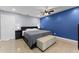 Spacious bedroom with stylish decor, a large bed, and a cozy seating area at 2832 Buccaneer Dr, Winter Park, FL 32792