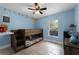 Playful bedroom featuring a wooden bunk bed, ceiling fan, and delightful wall decor at 2832 Buccaneer Dr, Winter Park, FL 32792