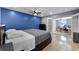 Comfortable bedroom featuring a modern ceiling fan and an adjoining office space through glass doors at 2832 Buccaneer Dr, Winter Park, FL 32792