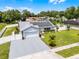 Charming single-story home featuring a solar panel roof, well-manicured lawn, and attached two-car garage at 2832 Buccaneer Dr, Winter Park, FL 32792