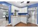 Open kitchen featuring granite countertops and wood floors at 2832 Buccaneer Dr, Winter Park, FL 32792