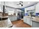 Bright kitchen with stainless steel refrigerator, and granite countertops at 2832 Buccaneer Dr, Winter Park, FL 32792
