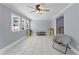 Spacious living room with tile floors and plenty of natural light from the large windows at 2832 Buccaneer Dr, Winter Park, FL 32792