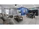 Open-concept living room with tile flooring, modern furnishings, and a view of the dining area at 2832 Buccaneer Dr, Winter Park, FL 32792
