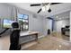 Office space featuring a large monitor and view into the bedroom, creating a convenient workspace at 2832 Buccaneer Dr, Winter Park, FL 32792