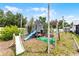 Backyard playset with multiple slides, a swing, and climbing features for ' outdoor fun at 2832 Buccaneer Dr, Winter Park, FL 32792