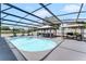 The pool is surrounded by lounge chairs, shade cabanas, and an outdoor grill area for fun in the sun at 2832 Buccaneer Dr, Winter Park, FL 32792