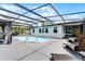 Inviting pool area featuring a pool, lounge chairs, and a covered patio at 2832 Buccaneer Dr, Winter Park, FL 32792