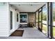 Covered porch featuring decorative stone wall, seating, and screened windows at 2832 Buccaneer Dr, Winter Park, FL 32792