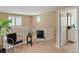 Hallway with comfortable chairs, a view of the windows, and entrance to another room at 2880 Old Castle Dr, Winter Park, FL 32792