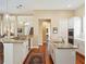 Spacious kitchen with granite countertops, double sinks, hardwood floors and stainless appliances at 2880 Old Castle Dr, Winter Park, FL 32792