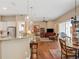 Open floor plan featuring the gourmet kitchen looking into a spacious living room at 2880 Old Castle Dr, Winter Park, FL 32792