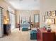 Bright main bedroom features a four-poster bed, neutral tones, and a cozy seating area at 2880 Old Castle Dr, Winter Park, FL 32792
