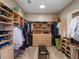 Organized walk-in closet provides ample storage space with shelves, drawers, and hanging racks at 2880 Old Castle Dr, Winter Park, FL 32792