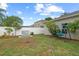 Well-maintained backyard with lush lawn, mature trees, and a privacy fence is great for Gathering gatherings at 298 Clydesdale Cir, Sanford, FL 32773